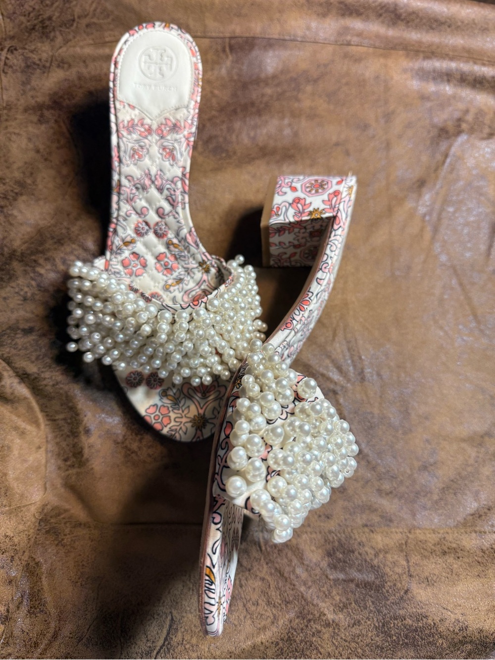 29. Tory Burch Pearl-Embellished Floral Block Heel Sandals in Cream and Pink